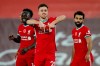 Liverpool's Diogo Jota, centre, celebrates scoring his sides second goal during the English Premier League soccer match between Liverpool and West Ham United at Anfield stadium in Liverpool, England, Saturday, Oct. 31, 2020. (Clive Brunskill/Pool via AP)