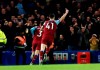 West Ham's Aaron Cresswell celebrates scoring West Hams first goal during the English Premier League soccer match between Chelsea and West Ham at Stamford Bridge Stadium in Lonodn, England, in London, England, Saturday, Nov. 30, 2019. (AP Photo/Leila Coker)