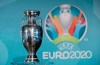 FILE - In this Thursday, Oct. 27, 2016 file photo, the Euro soccer championships trophy is seen in front of the logo during the presentation of Munich's logo as one of the host cities of the Euro 2020 European soccer championships in Munich, Germany. With 100 days to go, UEFA is pushing ahead with staging the European Championship across the continent. All 12 cities, however, might no longer make the cut. Bilbao, Dublin and Glasgow risk being dropped over the lack of guarantees about the number of fans that could be allowed into stadiums by June 2021. (AP Photo/Matthias Schrader, File)