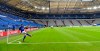 FILE - In this May 24, 2020 file photo, Schalke's Daniel Caligiuri kicks the ball in front of empty seats during the German Bundesliga soccer match between FC Schalke 04 and FC Augsburg at the Veltins-Arena in Gelsenkirchen, Germany. Soccer clubs are finding creative ways to stem revenue losses by offering season ticket holders alternatives to refunds for games being played in empty stadiums because of coronavirus pandemic. Teams are offering live streams of matches, future discounts, free tickets to cup games and credit for 2020-21 season tickets in exchange for refunds. Many clubs also give the option of sending refunds to a charity. (AP Photo/Martin Meissner, File)