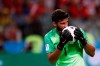 FILE - In this Wednesday, June 27, 2018 file photo, Brazil goalkeeper Alisson kisses the ball after makes a save during their World Cup soccer match against Serbia. There will be no more kissing the ball for good luck in South American soccer. Forget about exchanging jerseys and even spitting or blowing noses on the field also. The soccer governing body of soccer in the region has released a series of specific regulations amid the coronavirus pandemic to protect everyone’s health when the Copa Libertadores eventually resumes. There is no date set for when the tournament will restart. (AP Photo/Matthias Schrader)