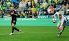 FILE - In this Wednesday, July 17, 2019 file photo, Borussia Dortmund's Gio Reyna, left, reacts after missing a shot against Seattle Sounders goalkeeper Bryan Meredith during a friendly soccer match, in Seattle. Gio Reyna, already the youngest American to play in the Bundesliga, is making his first league start for Borussia Dortmund in the Ruhr derby against visiting Schalke. The 17-year-old Reyna was named in coach Lucien Favre’s starting lineup alongside fellow youngster Erling Haaland on Saturday, May 16, 2020 when the league resumes after a two-month break caused by the coronavirus. (AP Photo/Ted S. Warren, file)