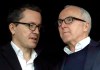 FILE - In this Sunday, Nov. 20, 2016 file photo, owner of the Olympique de Marseille soccer club, Frank McCourt, right, speaks to Olympique Marseille President Jacques-Henri Eyraud during the League One soccer match between Marseille and Caen, in Marseille, southern France. Marseille must pay UEFA several millions euros (dollars) for breaking rules that monitor club finances but retains its Champions League place. Their place in the Champions League group stage was earned by coach Andre Villas-Boas‚Äôs team being second to French champion Paris Saint-Germain when the league was ended early during the pandemic. Villas-Boas revived the 1993 European champion after being hired by Frank McCourt, the former Los Angeles Dodgers owner. (AP Photo/Claude Paris, file)