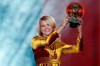 FILE - In this Dec. 3, 2018 file photo, Olympique Lyonnais soccer player Ada Hegerberg celebrates with the Women's Ballon d'Or award during the Golden Ball award ceremony at the Grand Palais in Paris, France. Hegerberg’s soccer season is over to have surgery on her injured right knee. European champion Lyon said Tuesday, Jan. 28, 2020 that the star striker ruptured her anterior cruciate ligament in a training session. (AP Photo/Christophe Ena, File)