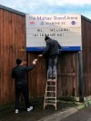 Volunteers hang up letters welcoming Tottenham Hotspur ahead of their FA Cup match, at Marine FC's home ground in Merseyside, England, Thursday, Jan. 7, 2021. The luxuries of their $1.5 billion Tottenham stadium will be a world away when Jose Mourinho takes his millionaire Premier League players to face Marine’s team of part-timers from the eighth division of English football on Sunday. The northwest coastal city of Crosby will provide very humble surroundings for the biggest mismatch in the history of the FA Cup. (AP Photo/James Caroll)