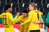 Dortmund's Jadon Sancho center, celebrates with teammates after scoring during the German Soccer Cup quarter final match between Borussia Moenchengladbach and Borussia Dortmund at Borussia Park, Moenchengladbach, Germany, Tuesday, March 2, 2021. (Federico Gambarini/Pool photo via AP)