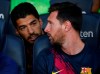 FILE - In this Sunday, Aug. 4, 2019 file photo, Barcelona's Lionel Messi, right, talks with teammate Luis Suarez on the bench before the Joan Gamper trophy soccer match against Arsenal at the Camp Nou stadium in Barcelona, Spain. Luis Suarez and Lionel Messi spent years hanging out at their neighboring homes on the Mediterranean coast when taking a break from scoring goals for Barcelona. On Saturday, May 8, 2021 Suarez will return to Camp Nou aiming to knock his former team out of the Spanish league title race.(AP Photo/Joan Monfort, file)
