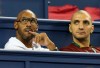 FILE - In this Wednesday Oct. 10, 2012 file photo, French soccer player Nicolas Anelka, left, watches as Roger Federer of Switzerland faces Lu Yen-hsun of Taiwan during the second round men's singles tennis match of the Shanghai Masters tennis tournament at Qizhong Forest Sports City Tennis Center in Shanghai, China. Former France and Chelsea forward Nicolas Anelka was hired as the sporting director of fourth-tier French club Hyeres on Wednesday, Feb. 3, 2021. (AP Photo/Kin Cheung, file)