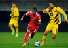 Union's Sheraldo Becker, left, in action against Dortmund's Emre Can during the German Bundesliga soccer match between 1. FC Union Berlin and Borussia Dortmund at the Stadion Alte Forsterei in Berlin, Friday, Dec. 18, 2020. (Soeren Stache/Pool Photo via AP)
