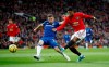 Manchester United's Marcus Rashford, right, has a shot on goal under pressure from Everton's Seamus Coleman during the English Premier League match between Manchester United and Everton at Old Trafford, Manchester, England, Sunday, Dec. 15, 2019. (Martin Rickett/PA via AP)
