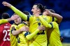 Sweden's Zlatan Ibrahimovic, center, celebrates scoring his side's first goal during World Cup 2022 qualifier group A soccer game between Sweden and Georgia at Friends Arena in Stockholm, Thursday March 25, 2021. (Pontus Lundahl/TT News Agency via AP)