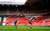 Manchester United's Ella Toone, right, and West Ham United's Cecilie Redisch Kvamme battle for the ball during the Women's Super League match at Old Trafford, Manchester, England, Saturday, March 27, 2021. The Manchester United women’s team has made its Old Trafford debut in a league game against West Ham. The team normally plays its Women’s Super League home matches at Leigh Sports Village but switched to Old Trafford during the international break in the men’s game. (Zac Goodwin/PA via AP)