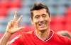 Bayern's Robert Lewandowski celebrates after scoring his side's third goal of the game during the German Bundesliga soccer match between Bayern Munich and Frankfurt, in the Allianz Arena, Munich, Germany, Saturday, Oct. 24, 2020. (Matthias Balk/dpa via AP)