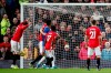 Manchester United's Victor Lindelof, left, scores an own goal, giving Everton their first goal of the game during the English Premier League match between Manchester United and Everton at Old Trafford, Manchester, England, Sunday, Dec. 15, 2019. (Martin Rickett/PA via AP)
