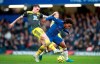 Southampton's Pierre-Emile Hojbjerg, left, and Chelsea's Willian battle for the ball during their English Premier League soccer match at Stamford Bridge, London, Thursday, Dec. 26, 2019. (Adam Davy/PA via AP)