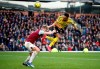 Arsenal's Pierre-Emerick Aubameyang, right, and Burnley's Ben Mee battle for the ball during the English Premier League soccer match between Burnley and Arsenal at Turf Moor, Burnley, England, Sunday, Feb. 2, 2020. (Martin Rickett/PA via AP)