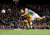Port Vale's Tom Pope, left, scores his side's first goal of the game during the English FA Cup third round soccer match between Manchester City and Port Vale at the Etihad Stadium, Manchester, England, Saturday, Jan. 4, 2020. (Martin Rickett/PA via AP)