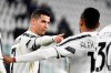Juventus' Cristiano Ronaldo, left, celebrates after scoring during the Serie A soccer match between Juventus and Crotone, at the Allianz Stadium in Turin, Italy, Monday, Feb. 22, 2021. (Marco Alpozzi/LaPresse via AP)