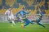 Roma's Lorenzo Pellegrini, left, in action against Parma’s Riccardo Gagliolo, center, during an Italian Cup soccer match between Parma and Roma at the Tardini Stadium, in Parma, Italy, Thursday, Jan. 16, 2020. (Fabio Rossi/Lapresse via AP)