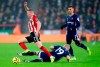 Sheffield United's John Lundstram, left, and Watford's Will Hughes battle for the ball during their English Premier League soccer match at Bramall Lane, Sheffield, England, Thursday, Dec. 26, 2019. (Mike Egerton/PA via AP)