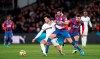 Crystal Palace's Luka Milivojevic, center, and West Ham United's Felipe Anderson battle for the ball during their English Premier League soccer match at Selhurst Park, London, Thursday, Dec. 26, 2019. (John Walton/PA via AP)
