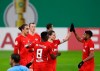 Leipzig's Christopher Nkunku, right, and goal scorer Marcel Sabitzer celebrate the goal during the German Soccer Cup 3rd round match between RB Leipzig and VfL Bochum at the Red Bull Arena in Leipzig, Germany, Wednesday, Feb. 3, 2021. ( Jan Woitas/dpa via AP)