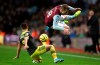 Aston Villa's Matt Targett, right, and Southampton's Cedric Soares battle for the ball during their English Premier League soccer match at Villa Park, Birmingham, England, Saturday, Dec. 21, 2019.(Nick Potts/PA via AP)