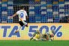 Atalanta's Luis Muriel has a shot blocked by Napoli's goalkeeper David Ospina during the Italian Cup, first-leg, semifinal soccer match between Napoli and Atalanta, at the Diego Armando Maradona Stadium in Naples, Italy, Wednesday, Feb. 3, 2021. (Alessandro Garofalo/LaPresse via AP)