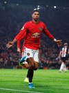 Manchester United's Marcus Rashford celebrates scoring his side's third goal of the game during their English Premier League soccer match against Newcastle United at Old Trafford, Manchester, England, Thursday, Dec. 26, 2019. (Martin Rickett/PA via AP)