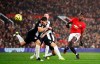 Manchester United's Paul Pogba shoots at goal during their English Premier League soccer match against Newcastle United at Old Trafford, Manchester, England, Thursday, Dec. 26, 2019. (Martin Rickett/PA via AP)