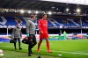 Liverpool's Virgil van Dijk leaves the match with an injury during the English Premier League soccer match between Everton and Liverpool at Goodison Park stadium, in Liverpool, England, Saturday, Oct. 17, 2020. (Laurence Griffiths/Pool via AP)