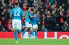 Napoli's Dries Mertens, right, celebrates scoring his side's first goal during the Champions League Group E soccer match between Liverpool and Napoli at Anfield stadium in Liverpool, England, Wednesday, Nov. 27, 2019. (AP Photo/Jon Super)