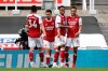 Arsenal's Pierre-Emerick Aubameyang, right, celebrates scoring his side's second goal with his teammates during the English Premier League soccer match between Newcastle United and Arsenal at St James' Park stadium, in Newcastle, England, Sunday, May 2, 2021. (Molly Darlington/Pool via AP)