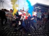 Leeds United fans celebrate outside Elland Road, Friday, July 17, 2020, on Leeds, England, after Huddersfield Town beat West Bromwich Albion to seal their promotion to the Premier League. (Nick Potts/PA via AP)