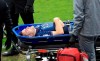 Swansea City's Jordan Morris is stretchered off the field after getting hurt during a Sky Bet Championship soccer match against Huddersfield, Saturday, Feb. 20, 2021, at John Smith's Stadium in Huddersfield, England. (Mike Egerton/PA via AP)