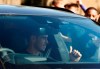 Soccer player Gareth Bale gestures to fans as he arrives at the training ground of Tottenham Hotspur in London, Friday Sept. 18, 2020. Real Madrid winger Gareth Bale is in London to complete his return to Tottenham. Bale left Tottenham for Madrid in 2013 for 100 million euros. (AP Photo/Frank Augstein)
