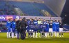 Millwall and Queens Park Rangers players hold up an Equality United For Change banner prior to the Championship match at The Den, London, Tuesday Dec. 8, 2020. (John Walton/PA via AP)