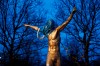A blue plastic bag and a toilet seat hangs from the statue of the Swedish football player Zlatan Ibrahimovic in Malmo, Wednesday Nov. 27, 2019. A fence has been placed around a statue of Zlatan Ibrahimovic and security guards have been keeping watch after it was vandalized by Malmo soccer fans furious at the Swedish soccer star buying a stake in a rival club. (Andreas Hillergren/TT via AP)