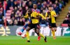 Crystal Palace's Jordan Ayew, rear, and Watford's Abdoulaye Doucoure battle for the ball during the English Premier League soccer match at Selhurst Park, London, Saturday March 7, 2020. (John Walton/PA via AP)