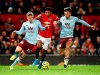 Manchester United's Marcus Rashford battles for the ball with Aston Villa's Matt Targett, left, and Jack Grealish during the English Premier League soccer match at Old Trafford, Manchester, England, Sunday Dec. 1, 2019. (Martin Rickett/PA via AP)