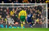 Tottenham Hotspur's Harry Kane, right, scores against Norwich City's Alexander Tettey during the English Premier League soccer match at Carrow Road, Norwich, England, Saturday Dec. 28, 2019. (Joe Giddens/PA via AP)