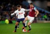 Tottenham Hotspur's Erik Lamela, left, and Burnley's James Tarkowski battle for the ball during the English Premier League soccer match at Turf Moor, Burnley, England, Saturday March 7, 2020. (Martin Rickett/PA via AP)