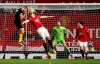 Manchester United's Harry Maguire heads the ball clear under pressure from Wolverhampton Wanderers' Romain Saiss during the English Premier League soccer match between Manchester United and Wolverhampton Wanderers, at Old Trafford, in Manchester, England, Saturday, Feb. 1, 2020. (Martin Rickett/PA via AP)