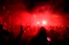Liverpool fans celebrate outside Anfield stadium after the English Premier soccer match between Liverpool and Chelsea, Wednesday, July 22, 2020, in Liverpool, England. (Martin Rickett/PA via AP)