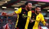 Watford's Troy Deeney. left, scores his side's second goal of the game against Bournemouth, during their English Premier League soccer match at the Vitality Stadium in Bournemouth, England, Sunday, Jan. 12, 2020. (Adam Davy/PA via AP)