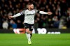 Derby County's Wayne Rooney gestures to his team-mates during the match against Barnsley, during their English Championship soccer match at Pride Park in Derby, England, Thursday Jan. 2, 2020. (Bradley Collyer/PA via AP)