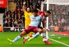 Aston Villa's Tyrone Mings, left, and Southampton's Shane Long during their English Premier League soccer match at St Mary's Southampton, England, Saturday Feb. 22, 2020. (Mark Kerton/PA via AP)