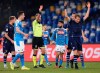 Lucas Leiva Pezzini of Lazio, right, receives the red card from referee Davide Massa, during the game against Napoli during their Italian Cup Serie A quarterfinal soccer match at San Paolo stadium in Napoli, Italy, Tuesday Jan. 21, 2020. (LaPresse via AP)