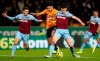 Wolverhampton Wanderers's Raul Jimenez, centre, challenges with West Ham United's Declan Rice, right, and Aaron Cresswell during their English Premier League soccer match at Molineux in Wolverhampton, England, Wednesday Dec. 4, 2019. (David Davies/PA via AP)