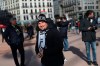 A Juventus supporter visits Lyon, central France, ahead of the Champions League , round of 16th, first leg match Lyon against Juventus, Wednesday Feb. 26, 2020. Up to 3,000 Juventus fans are expected. As the coronavirus cases clustered in northern Italy kept climbing and European countries reported new ones with Italian travel ties Tuesday, authorities across the continent tried to strike a balance between taking prudent public health measures and preventing panic. (AP Photo/Daniel Cole)